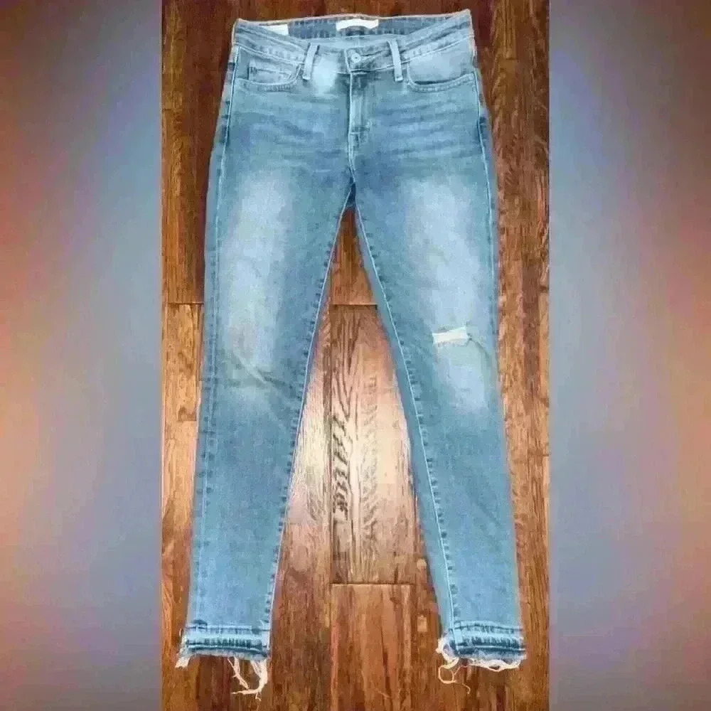 LEVIS Premium 711 Mid Rise Skinny Jean with Raw Hem in Light Wash